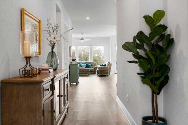 hall with light wood-type flooring