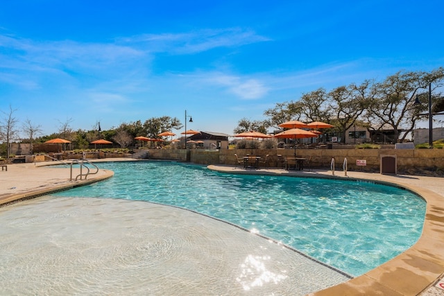 view of pool featuring a patio