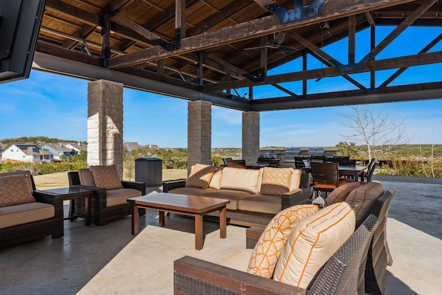 view of patio / terrace featuring a gazebo, ceiling fan, and an outdoor living space