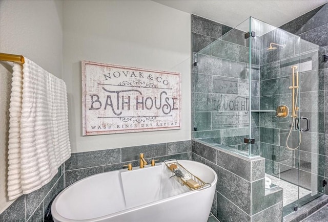 bathroom featuring independent shower and bath