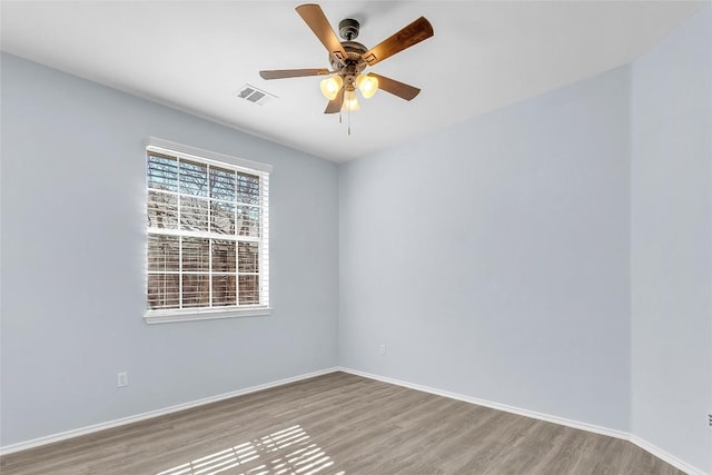 unfurnished room featuring ceiling fan and hardwood / wood-style floors