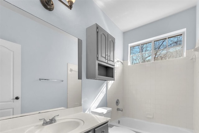 full bathroom with vanity, washtub / shower combination, and toilet