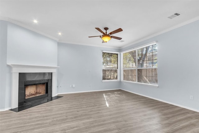 unfurnished living room featuring crown molding, wood-type flooring, and ceiling fan