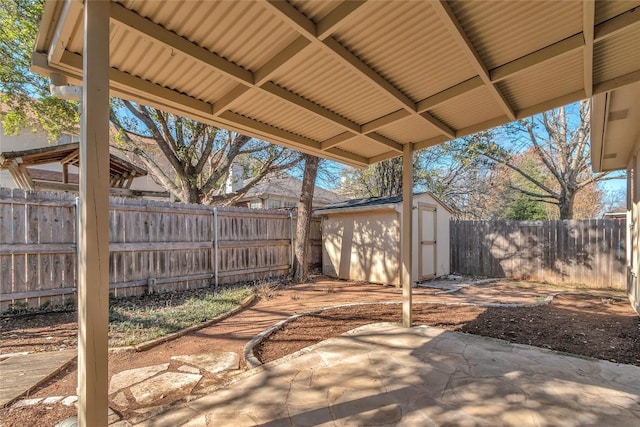 view of patio with a storage unit