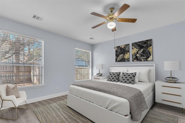 bedroom featuring ceiling fan and dark hardwood / wood-style flooring