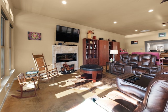 living room with a tiled fireplace