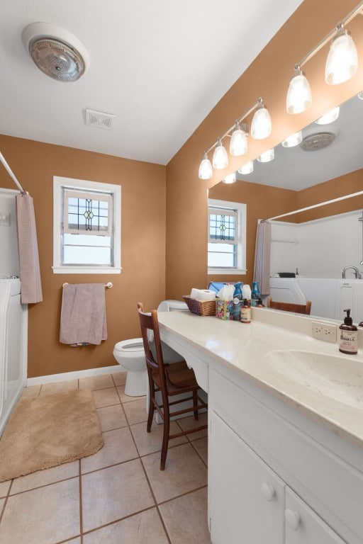 bathroom featuring tile patterned flooring, vanity, toilet, and a shower with shower curtain