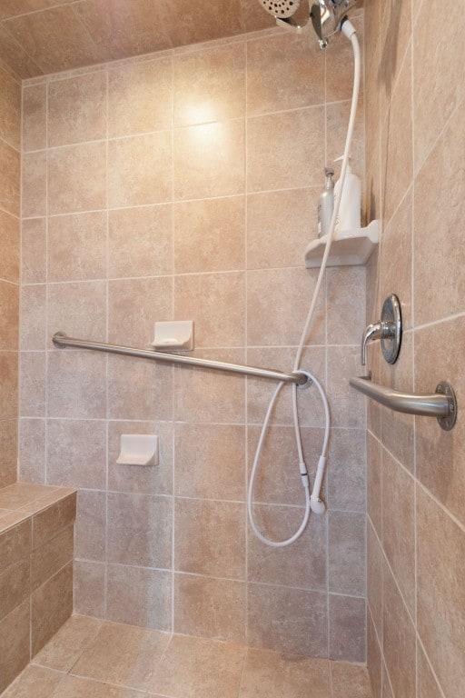 bathroom with tiled shower