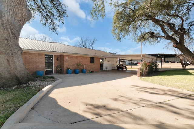 back of property with a carport