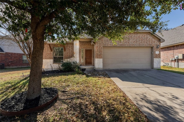 single story home with cooling unit and a garage