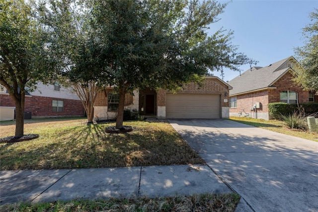 view of front of property with a garage and a front yard