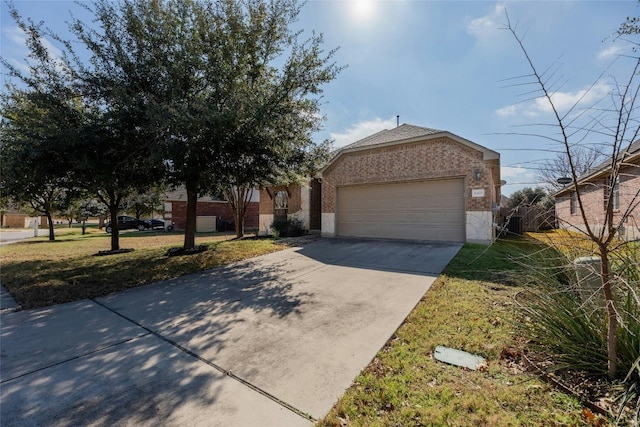 view of front of home featuring a garage and a front lawn