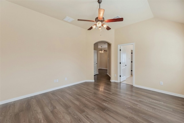 spare room featuring ceiling fan, lofted ceiling, and dark hardwood / wood-style flooring