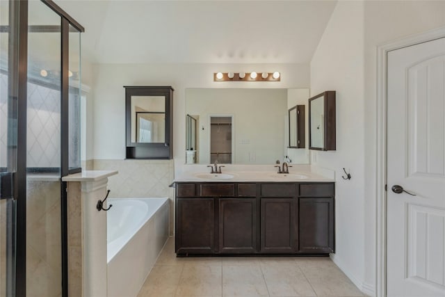 bathroom featuring vanity, tile patterned floors, and plus walk in shower