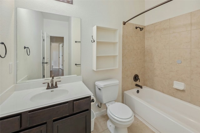 full bathroom featuring vanity, tile patterned floors, toilet, and tiled shower / bath