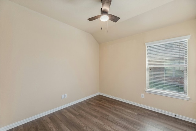 spare room with vaulted ceiling, hardwood / wood-style floors, and ceiling fan