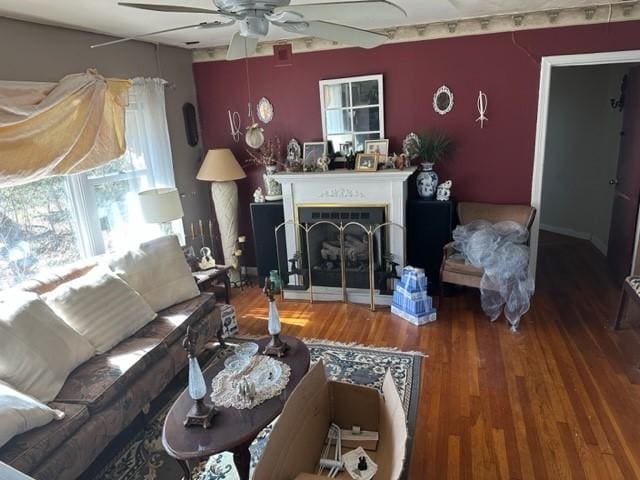 living room featuring hardwood / wood-style flooring and ceiling fan