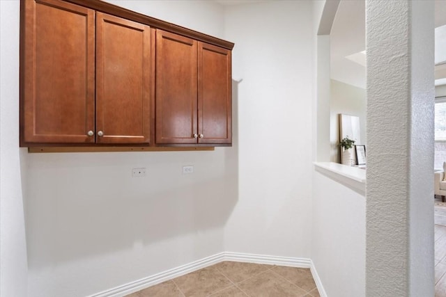 laundry room with light tile patterned floors