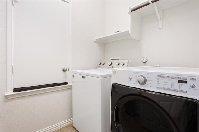 washroom featuring separate washer and dryer