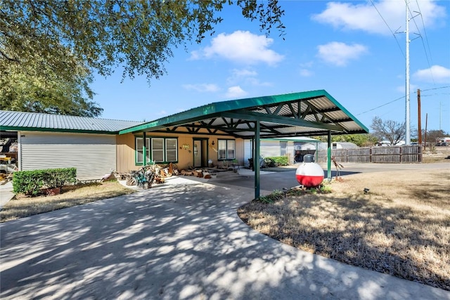 exterior space with a carport