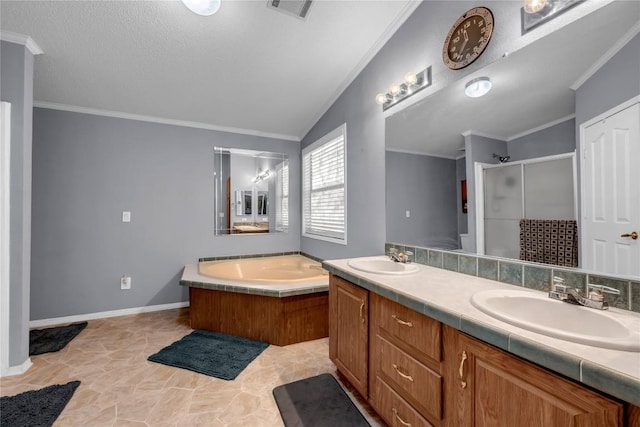 bathroom with lofted ceiling, vanity, ornamental molding, a textured ceiling, and separate shower and tub