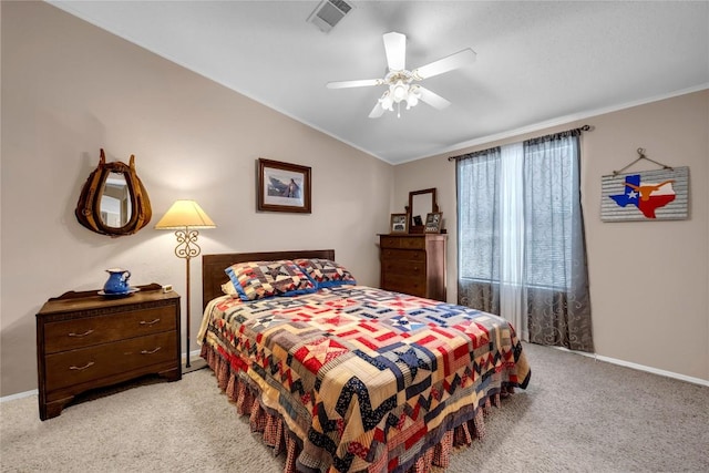 carpeted bedroom featuring vaulted ceiling and ceiling fan