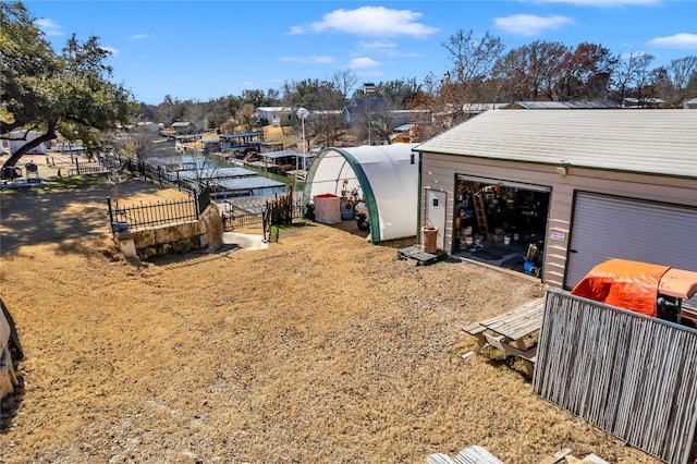 view of yard featuring an outbuilding and a garage