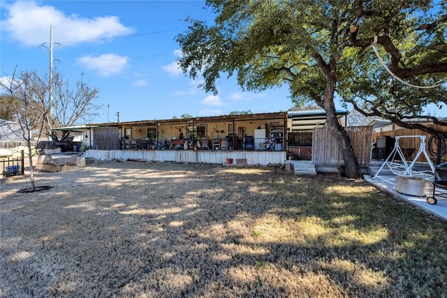 back of house with a yard