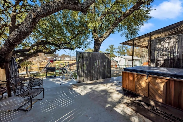 view of patio with a hot tub