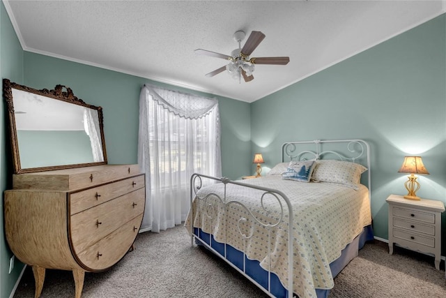 carpeted bedroom featuring crown molding, ceiling fan, and a textured ceiling