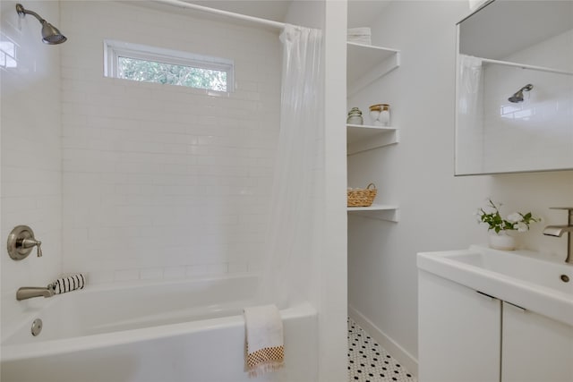 bathroom with shower / bathtub combination with curtain and sink