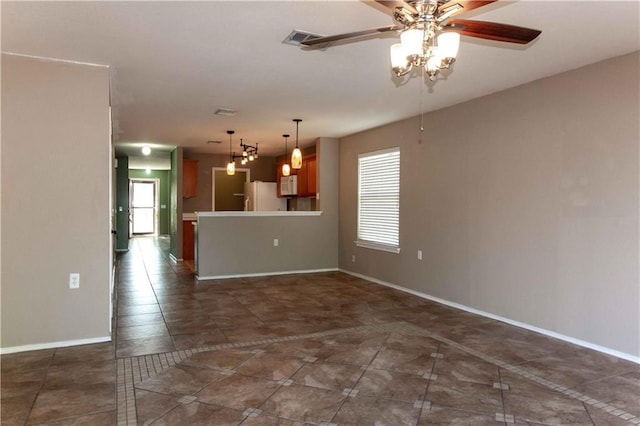 unfurnished living room featuring ceiling fan