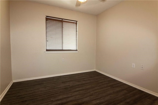 empty room with dark wood-type flooring and ceiling fan