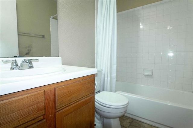 full bathroom featuring tile patterned flooring, vanity, shower / bath combo, and toilet