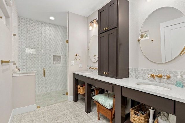 bathroom featuring tile patterned flooring, vanity, and an enclosed shower