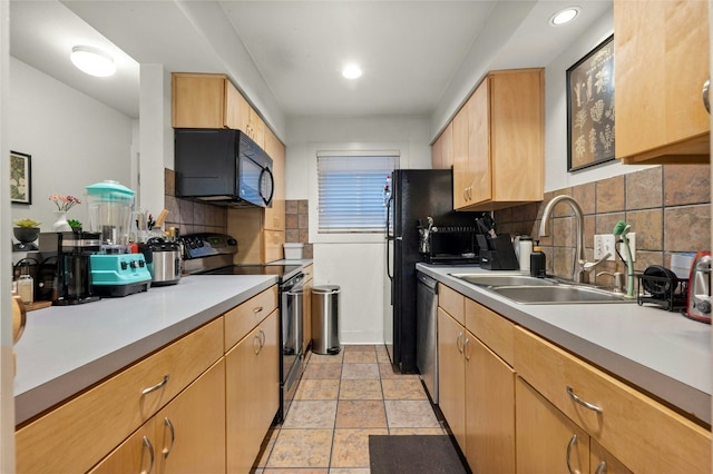 kitchen featuring tasteful backsplash, sink, light brown cabinets, and black appliances