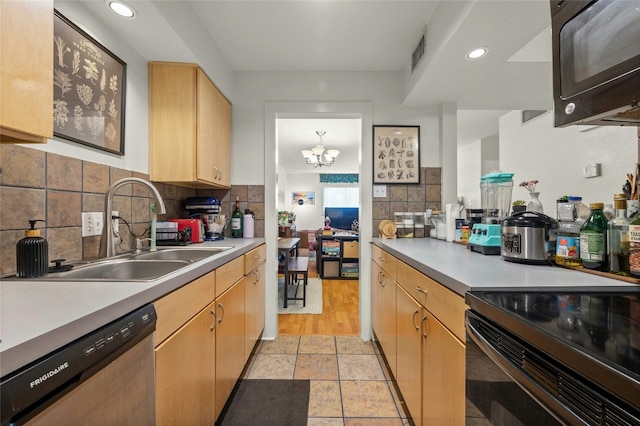 kitchen with sink, a chandelier, light brown cabinets, decorative backsplash, and black appliances