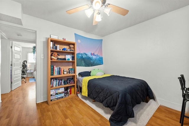 bedroom featuring hardwood / wood-style flooring and ceiling fan