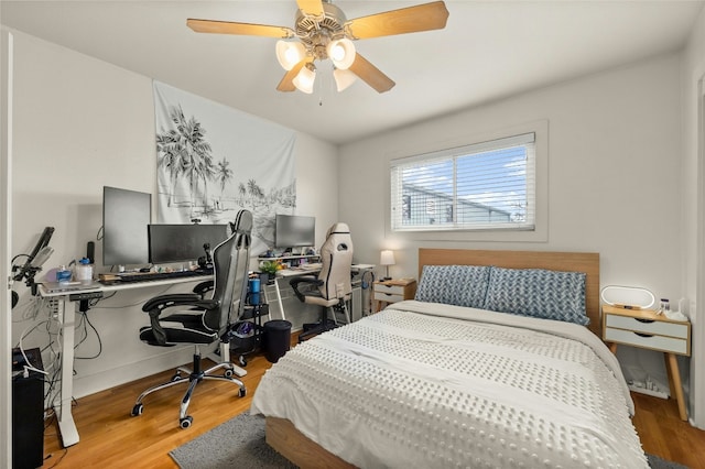 bedroom featuring ceiling fan and wood-type flooring