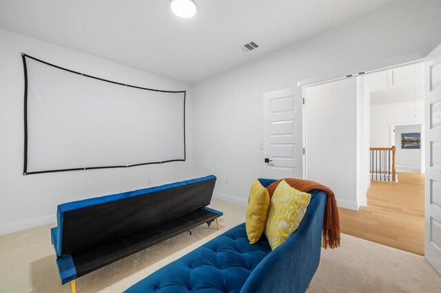 7224 Getaway Dr, Jonestown, TX 78645 - carpeted home theater room with baseboards and wood finished floors