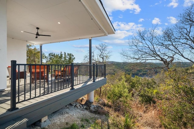 wooden terrace featuring ceiling fan