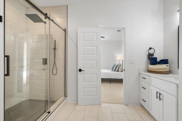 bathroom with vanity and a shower with shower door