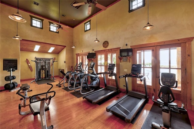 7224 Getaway Dr, Jonestown, TX 78645 - gym featuring french doors, a high ceiling, ceiling fan, and healthy amount of natural light