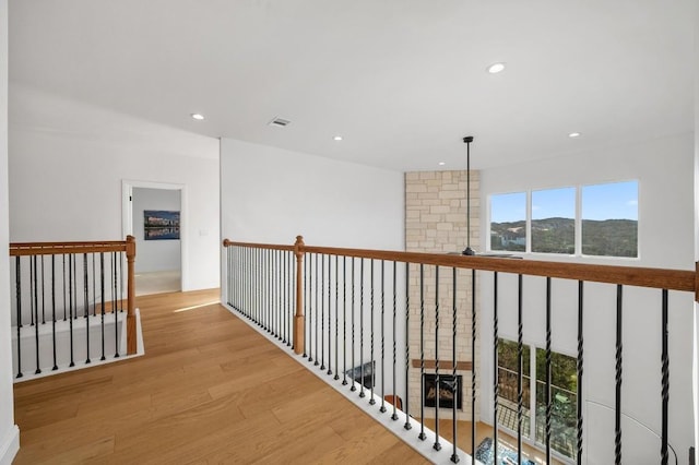 hall featuring a mountain view and light hardwood / wood-style floors