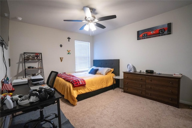 bedroom featuring light colored carpet and ceiling fan