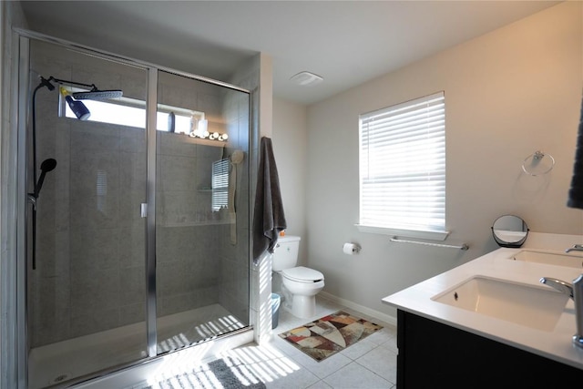 bathroom with vanity, toilet, an enclosed shower, and tile patterned flooring