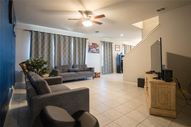 tiled living room featuring ceiling fan