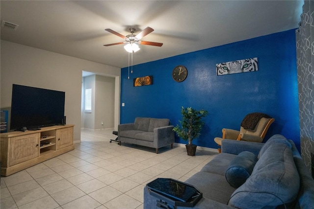 tiled living room with ceiling fan