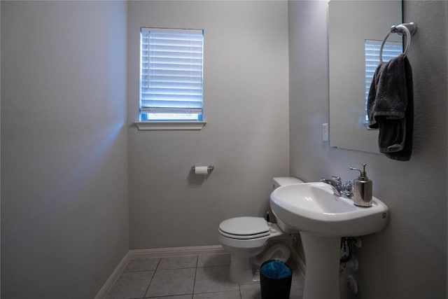 bathroom featuring tile patterned flooring and toilet