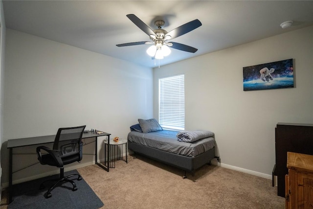 bedroom with ceiling fan and light colored carpet